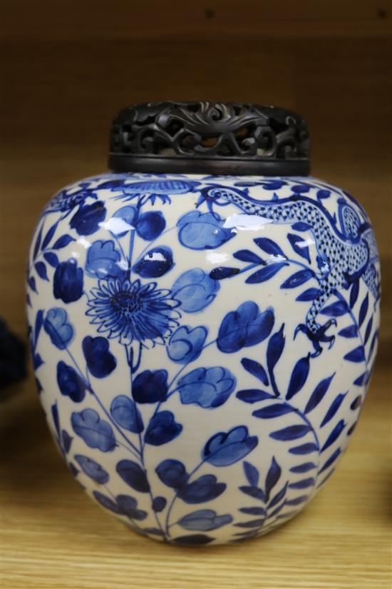 A Chinese blue and white jar, with hardwood cover height 22cm